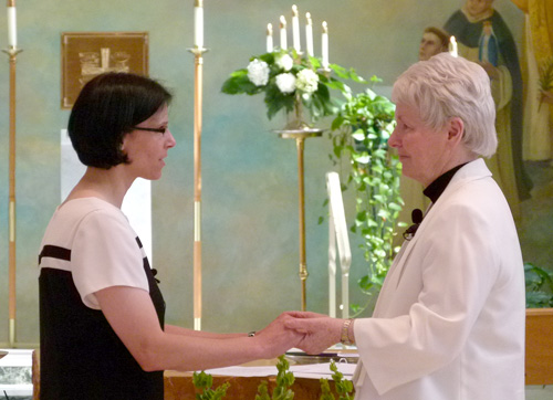 Sister Bea professes her vows to Sister Margaret Ormond, OP, prioress of the Dominican Sisters of Peace.