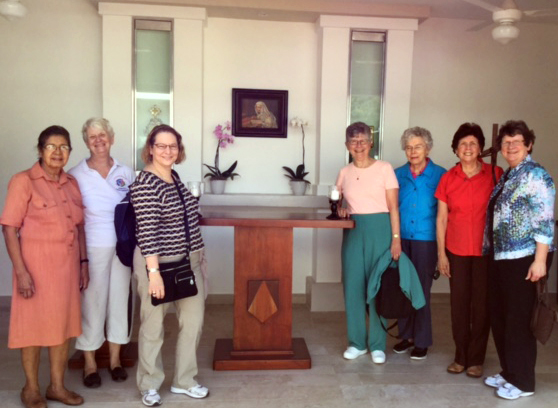 Standing around the altar are, from left, Sisters Luisa Campos,  OP, Carol Gross, OP, Lorraine Réaume, OP, Tarianne DeYonker, OP, Attracta Kelly, OP, Rosa Monique Peña, OP and Corinne Sanders, OP.