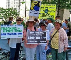 Dominican Sisters Jean Fallon, Ceil Lavan, Pat Langton & Cely Byrnes waiting in the shade to march in the Clean Energy Revolution.