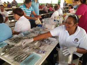 Juana Franco, Associate, helps to sterilize the instruments