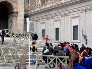 Delegates to the World Meeting of Popular Movements gathering follow the cross to one of the Doors of Mercy in Rome. (Photo by Sister Cheryl Liske, OP)