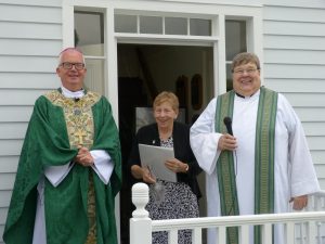 Bishop of Madison Donald J. Hying; Sister Priscilla Wood, OP; and Father Dave Flanagan stand outside the restored home of Father Samuel Mazzuchelli, OP, the day it was blessed and reopened in August 2019. Visitors are welcome to tour the home every Sunday from 2 to 4 p.m. June 7 through mid-October at St. Patrick Parish, Benton, Wis.